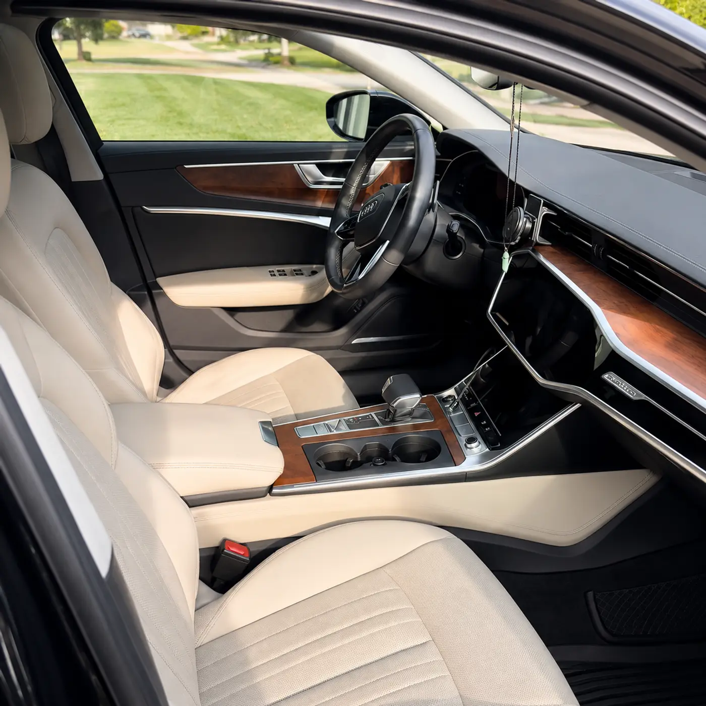 Meticulous interior auto detailing process, clean cabin leather steering wheel